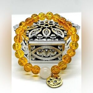 NWOT Handmade yellow bracelet with moonstone an evil eye charm